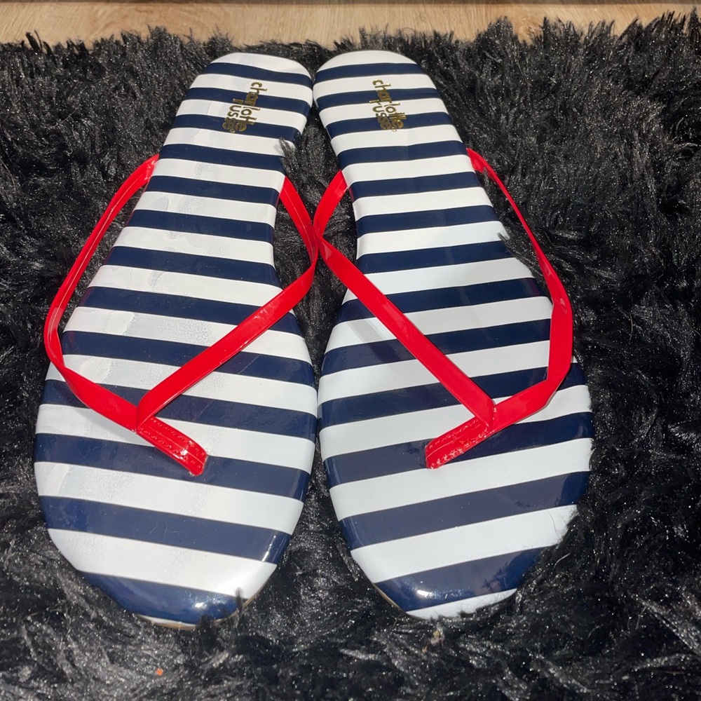 Red white and blue striped flip flops